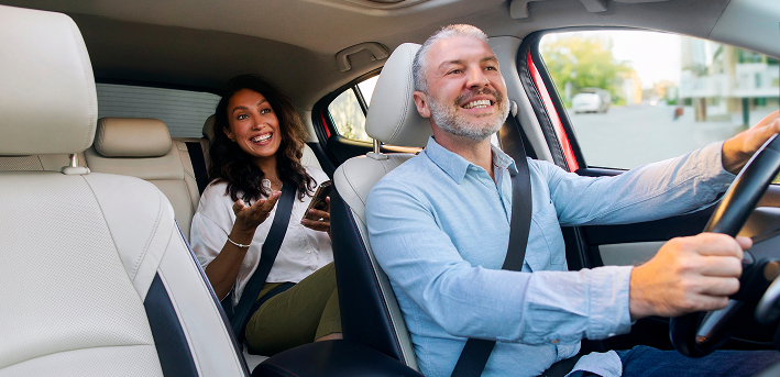 Happy rider in a Prime Time Rideshare vehicle