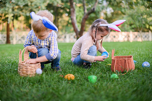 Kids on an Easter egg hunt wearing bunny ears
