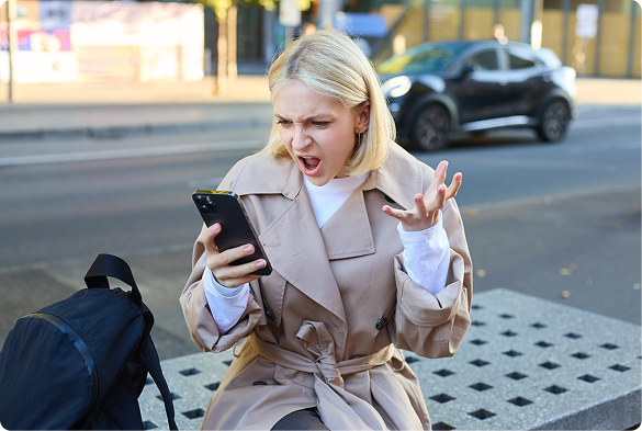 Frustrated passenger reacting to surge pricing on her phone