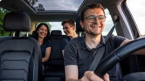 Smiling driver with passengers in a Prime Time Rideshare vehicle